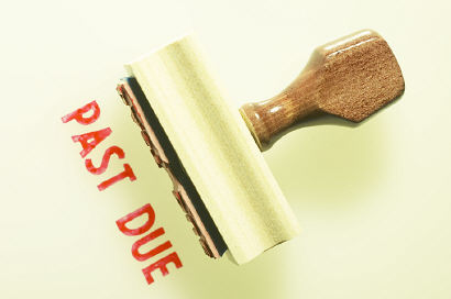 Past due stamp in red ink and stamper