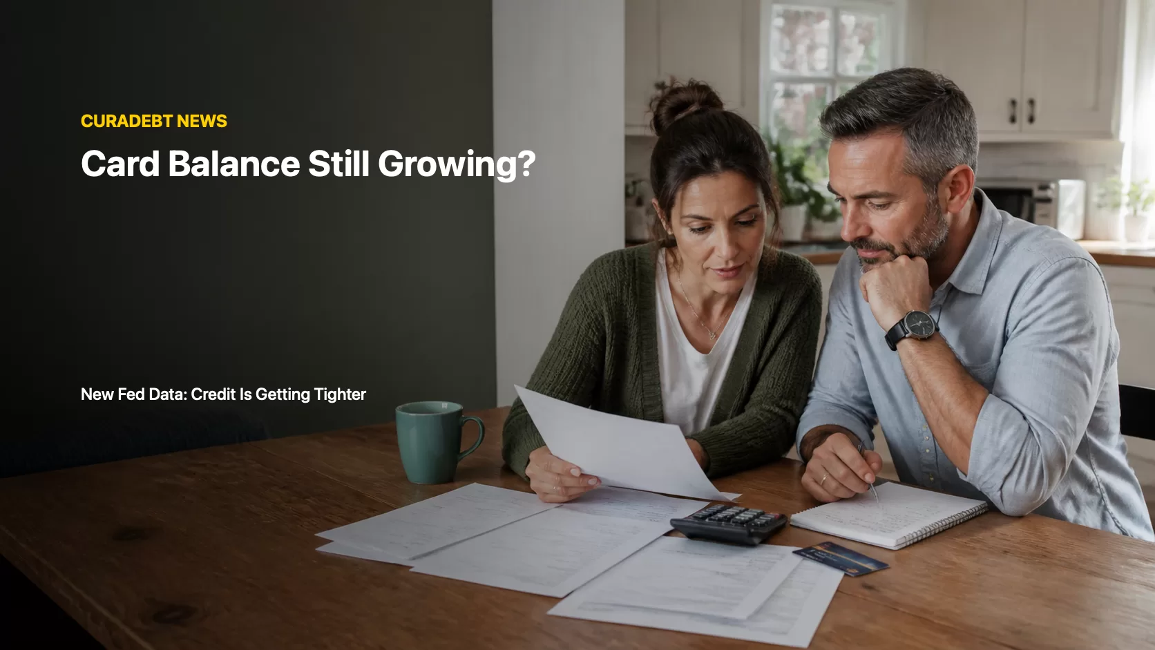 Household reviewing credit card statements and bills as a growing card balance meets tighter credit standards